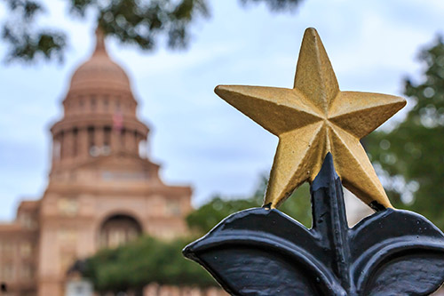 Star shaped golden ornament in front of the Texas State Capitol Building in Austin, TX